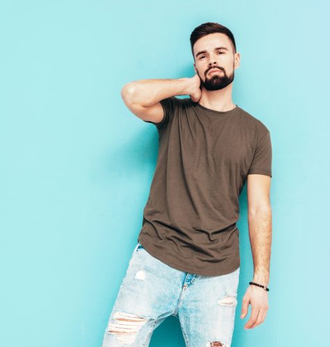 portrait-handsome-confident-stylish-hipster-lambersexual-modelman-dressed-tshirt-jeans-fashion-male-isolated-blue-wall-studio (1)